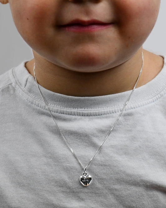 Dainty Sterling Silver Curved Heart Pendant With A Cross Engraved Centre